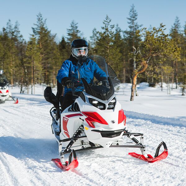 skidoo driving through the snow